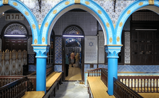 Interior with blue painted arches and tiled walls