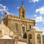 Stone church with a bell tower in the Holy Land