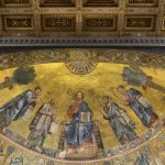 Golden apse mosaic of Christ in a basilica in Rome