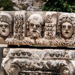 Carved theatre masks at Myra near Antalya