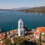Clock tower above the harbour of Poros